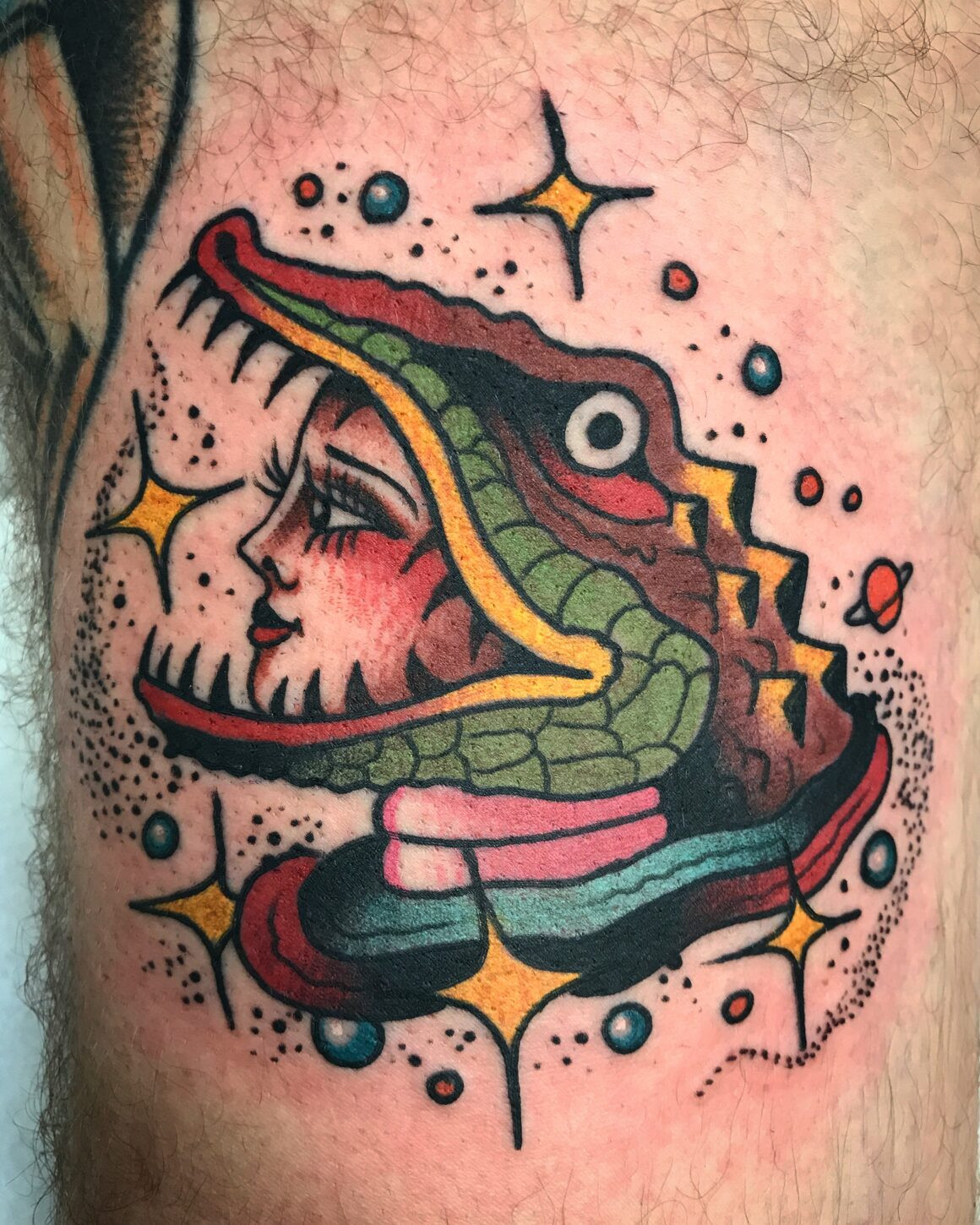 A bold and colorful traditional tattoo by El Chanok, showcasing his vibrant color choices