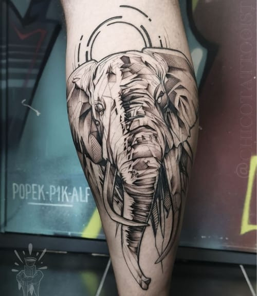 Realistic elephant head tattoo on the arm, symbolizing wisdom in men tattoo ideas.