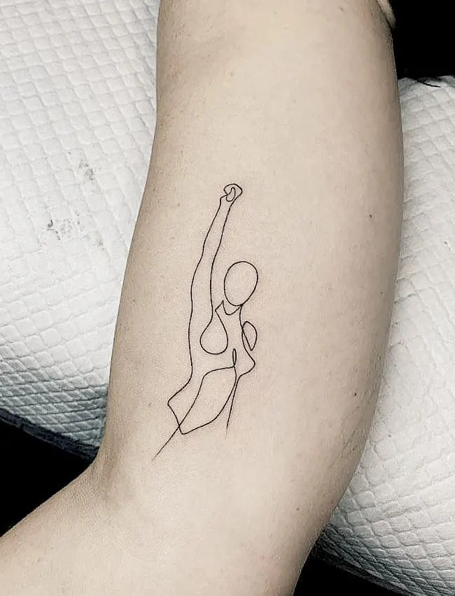 alt text: Minimalist line art tattoo of abstract shapes, symbolizing subtle yet powerful inner strength and empowerment