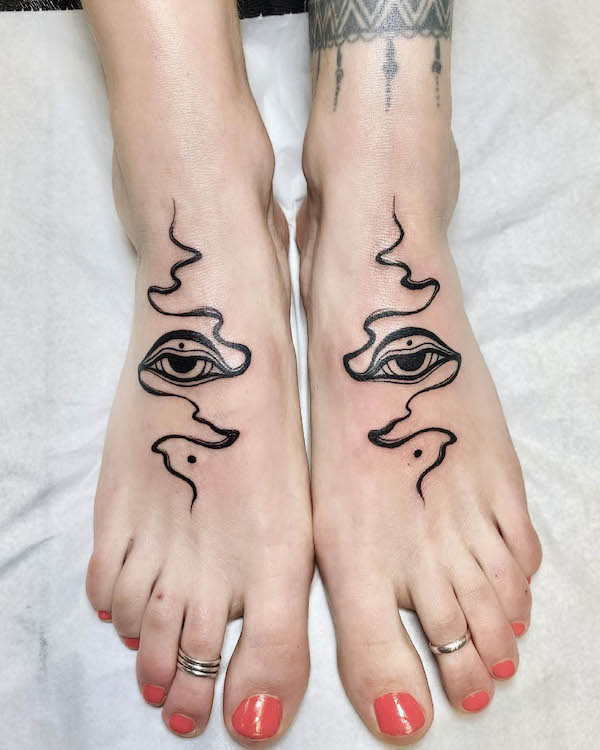 Eye and smoke foot tattoos for women, a mystical and observant design combining symbolic elements