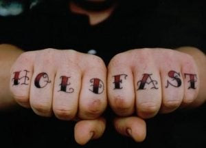 &quot;Hold Fast&quot; knuckle tattoos, a traditional sailor tattoo for perseverance and grip strength.