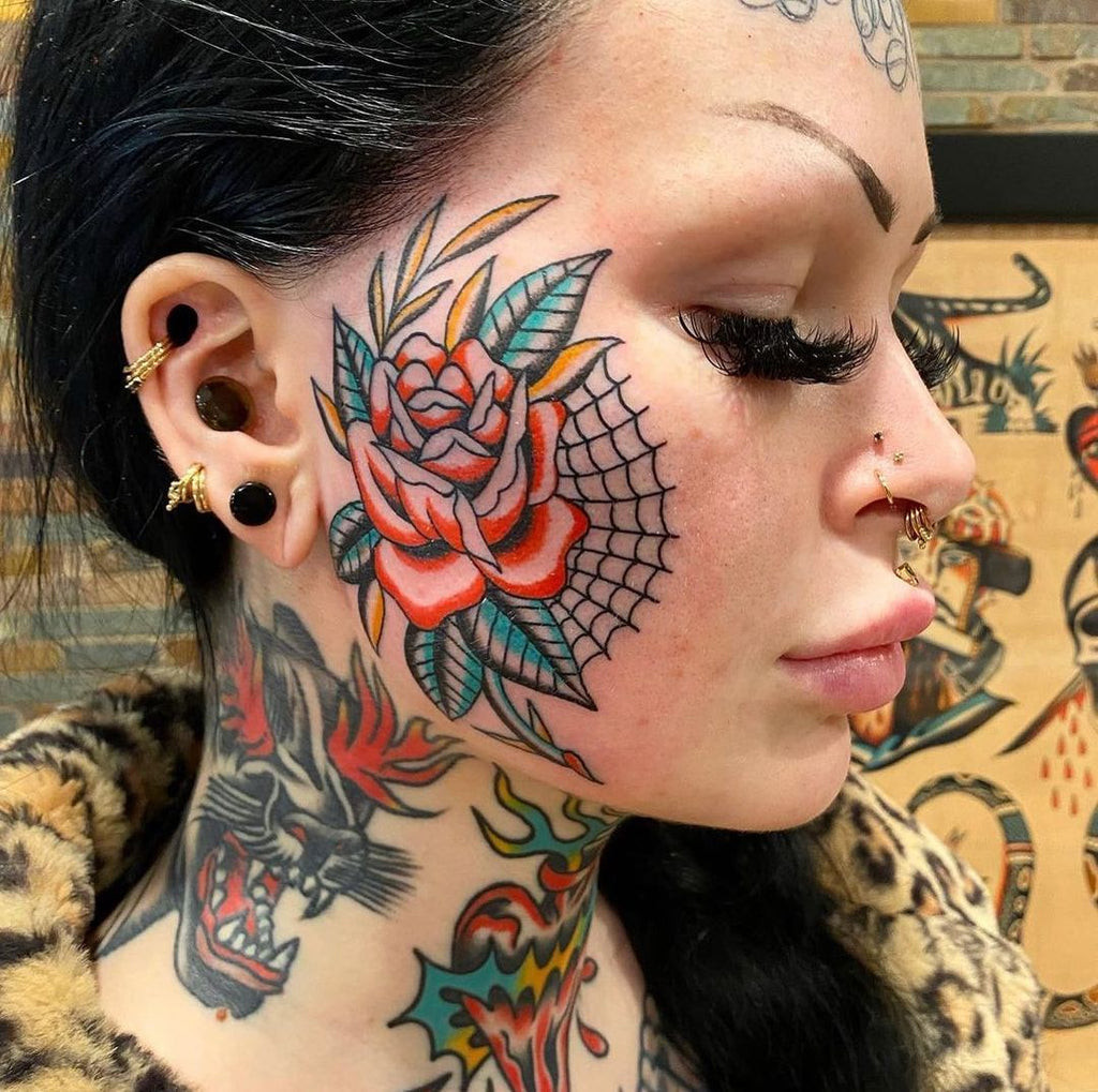 Traditional style face tattoo with bold lines and classic imagery, a cool and timeless approach to facial tattooing.