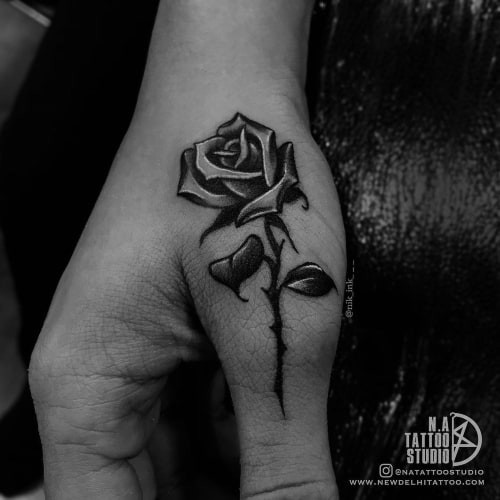 Finger tattoos with geometric shapes, showcasing small and modern designs for men.