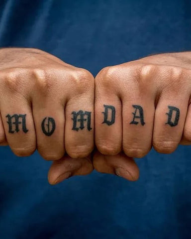 Finger tattoo of &quot;Mom&quot; and &quot;Dad&quot; hearts, a tribute to parents and family love