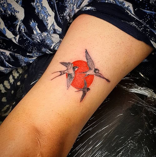 Striking flock of birds tattoo for men, symbolizing freedom, unity, and a journey together
