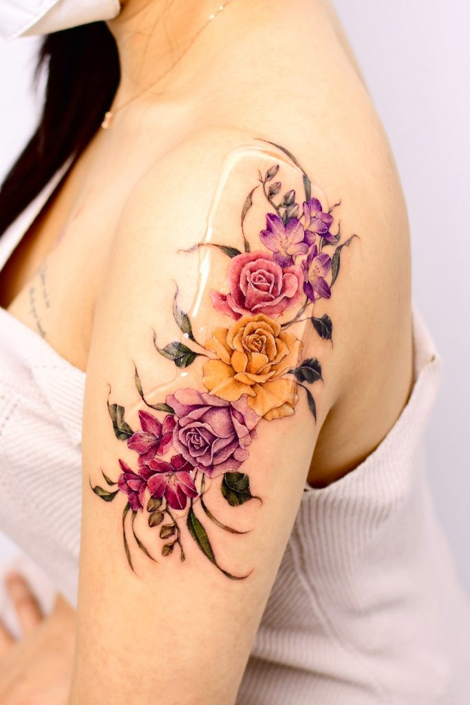 Detailed floral arm tattoo, a signature style of Yerae, ideal for those seeking delicate yet impactful cover-up floral tattoos.