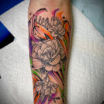 Floral sleeve tattoo in black and grey, December 2023