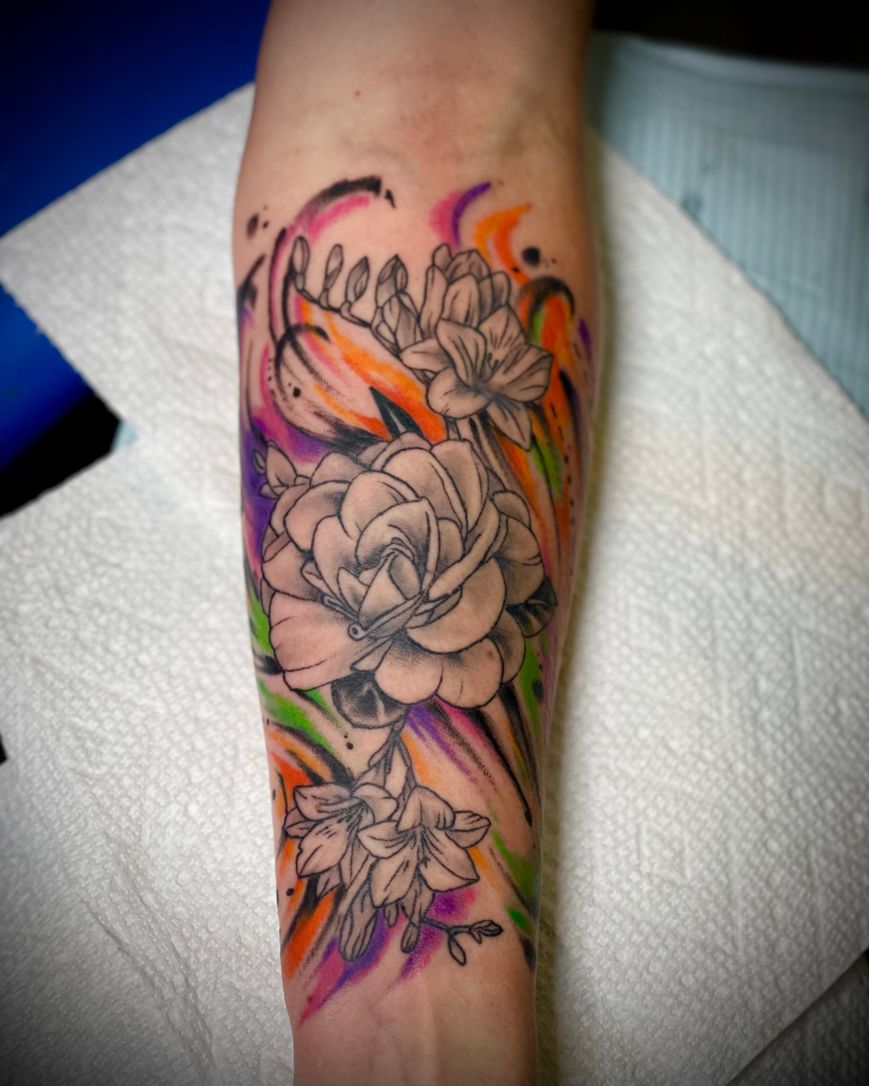 Floral sleeve tattoo in black and grey, December 2023