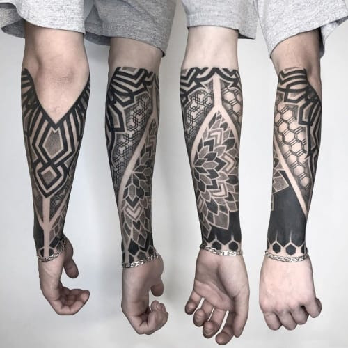 Forearm geometric tattoo placed on the forearm, showcasing geometric patterns that are ideal as a standalone piece or as part of a larger sleeve design.