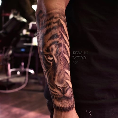 Detailed forearm tattoo sleeve on a man's arm