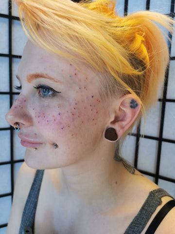 Face freckle tattoo placement