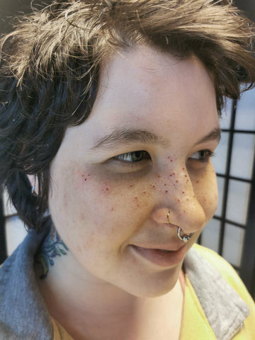 Freckle tattoos on nose and cheeks