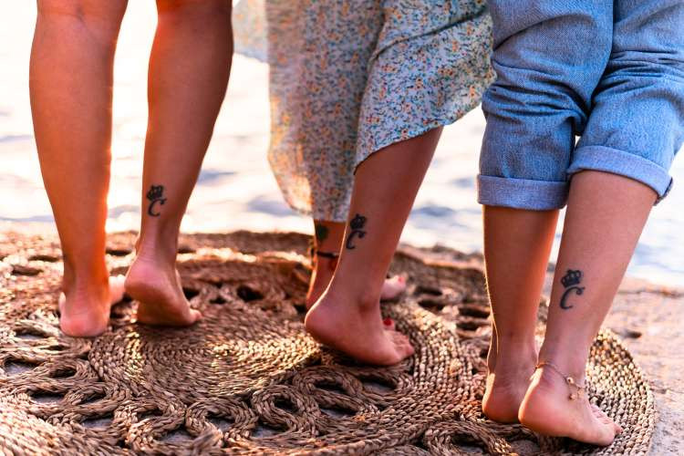 best friends with matching crown tattoos