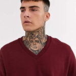 Intricate geometric full neck tattoo for men, showcasing sharp lines and modern design