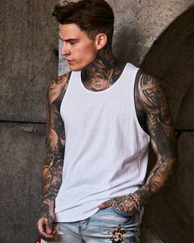 Intricate full sleeve tattoo in black and grey featuring detailed patterns and shading, covering the entire arm from shoulder to wrist.