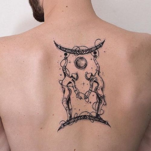 Abstract Gemini twin faces tattoo on the back