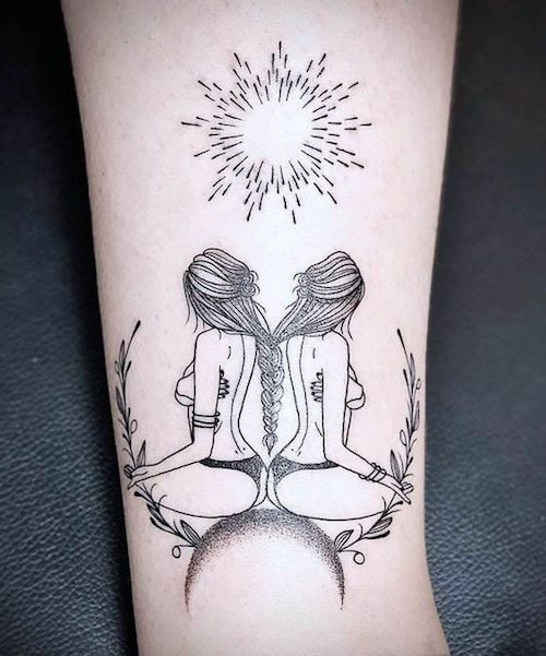 Watercolor style Gemini twins tattoo on the leg