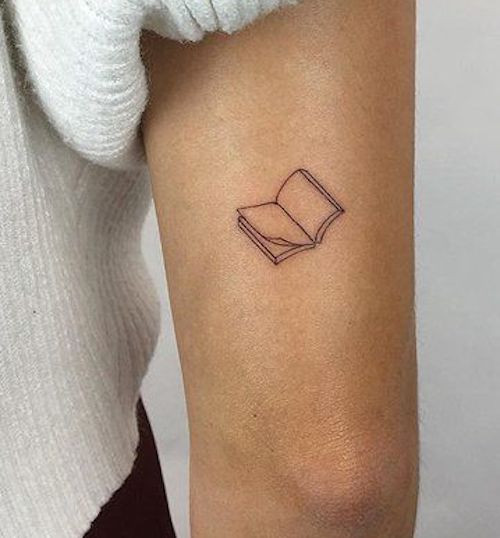 Open book tattoo symbolizing Gemini's intellect