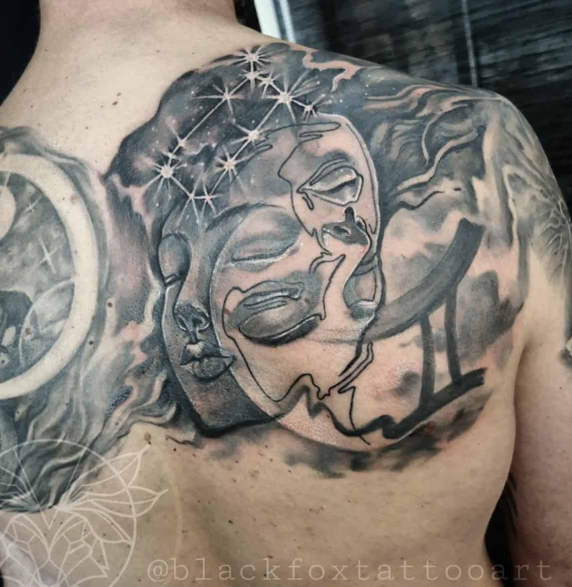 Man with Gemini Twin Back Tattoo