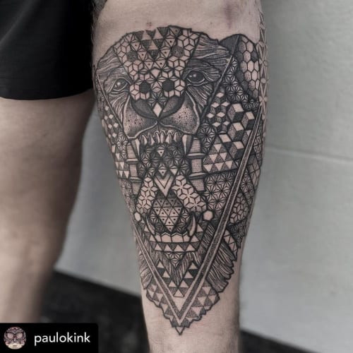 Geometric bear tattoo featuring a bear rendered in geometric shapes and lines, representing strength and solitude.