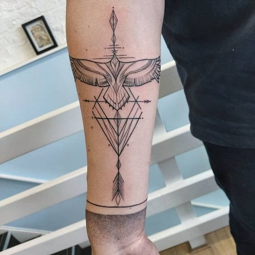 Modern geometric bird tattoo for men, symbolizing balance, symmetry, and intellectual design
