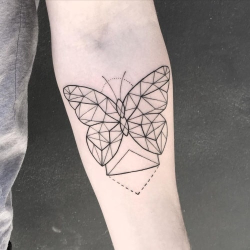 Geometric butterfly tattoo featuring a butterfly designed with geometric patterns and symmetrical shapes, symbolizing transformation and beauty.