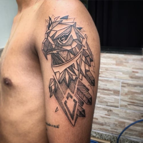 Geometric hawk tattoo depicting a hawk in flight or its head, designed with geometric angles and lines, symbolizing focus and sharp vision.