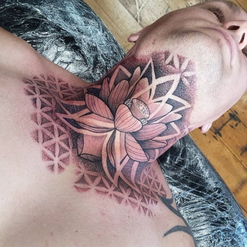 Geometric lotus tattoo featuring a lotus flower constructed from geometric shapes, symbolizing purity and spiritual awakening.