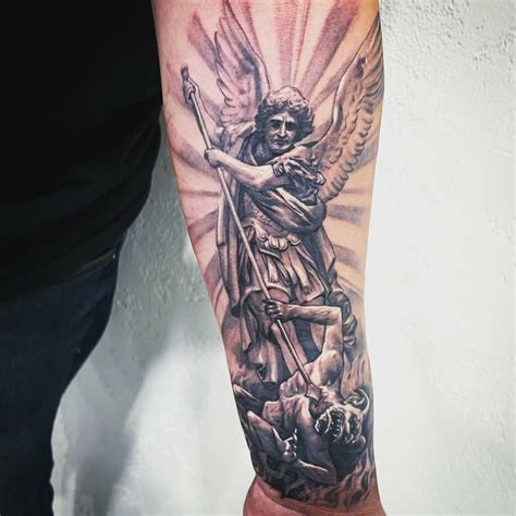 Preparing for a St. Michael Archangel tattoo session.