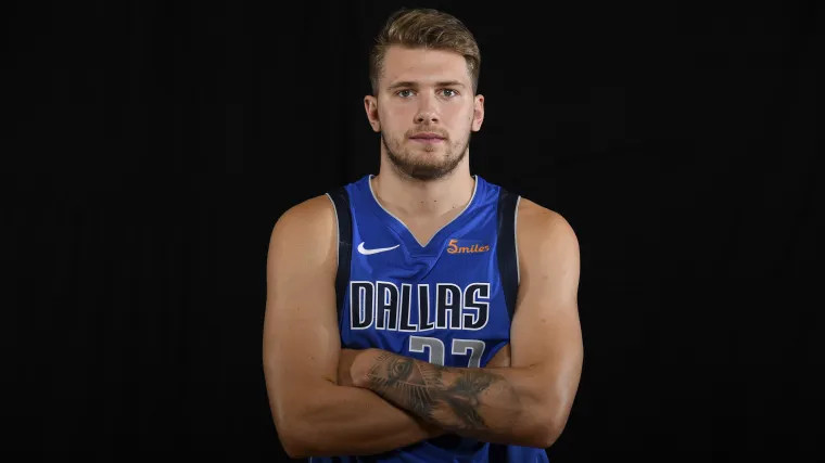Close-up of Luka Doncic's forearm tattoo featuring the eagle and Eye of Providence during his early NBA days
