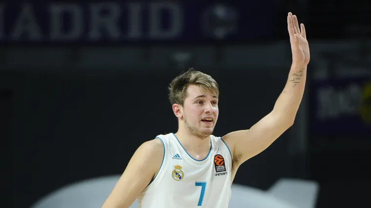Luka Doncic during a Real Madrid game, showcasing an early tattoo phase