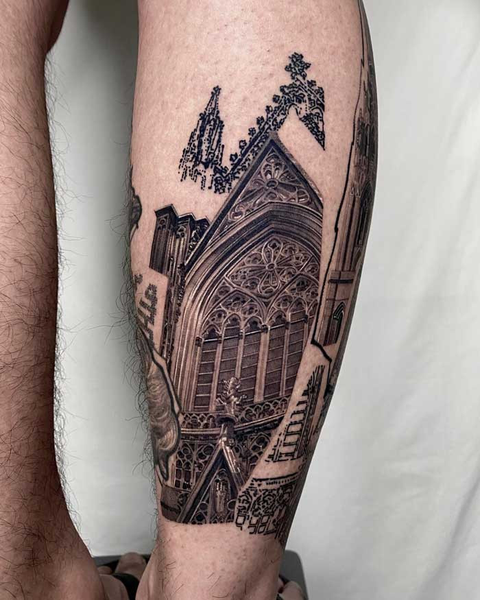 Gothic tattoo depicting cathedral architecture on leg, showcasing detailed arches, spires, and gothic design elements.