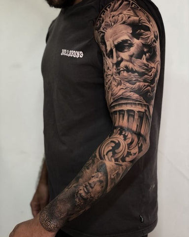 Greek God sleeve tattoo featuring Zeus, Poseidon, and Hades in a classical art style