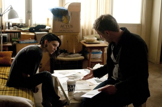 Lisbeth Salander looking intensely focused, highlighting the character's intellectual prowess and determination.