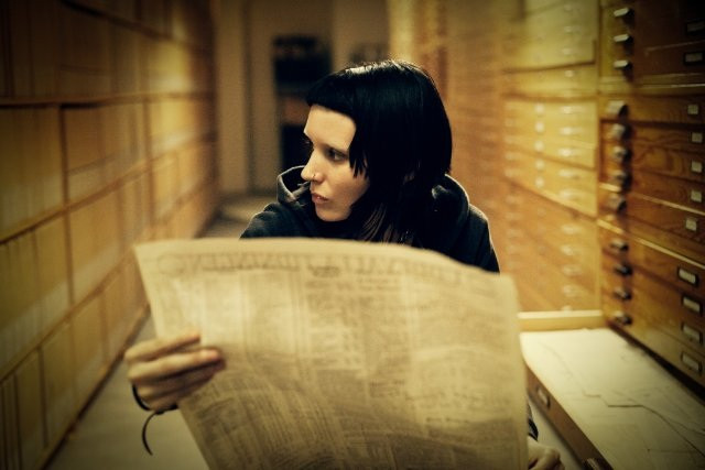 Rooney Mara as Lisbeth Salander in The Girl with the Dragon Tattoo, showcasing her intense gaze and the character's rebellious spirit.