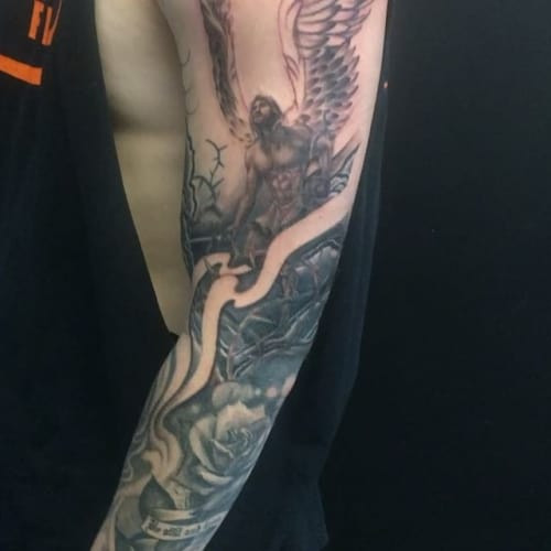 Substantial half sleeve angel tattoo, offering a balance between size and detail for arm placement.