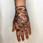 Detailed tribal hand tattoo for men