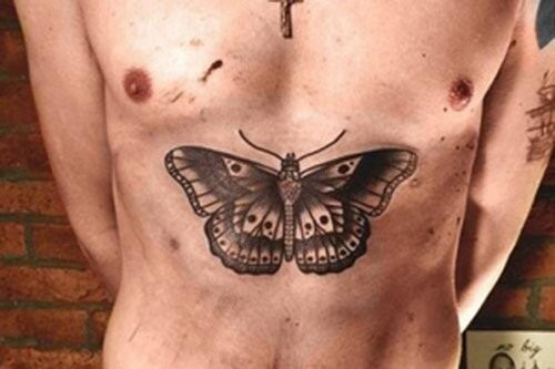 Harry Styles chest butterfly tattoo