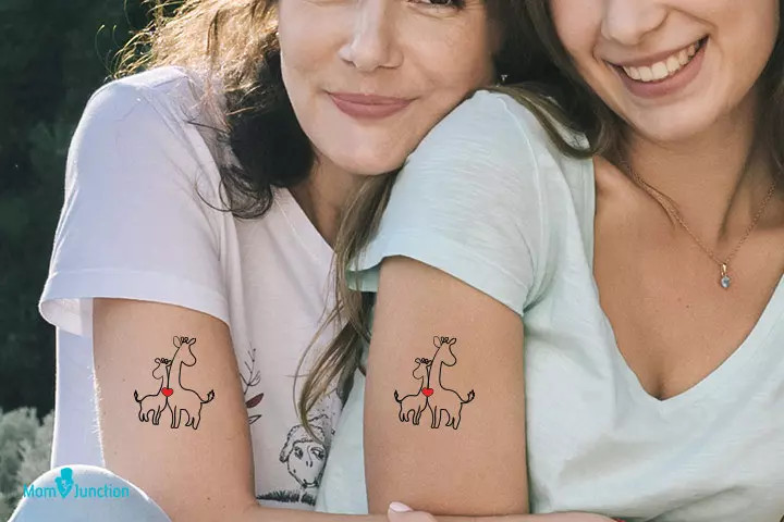 Mother and baby giraffe hearts tattoo, symbolizing mother-daughter love