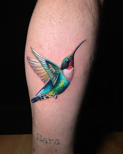 Energetic hummingbird tattoo for men, symbolizing freedom, optimism, and a love for life