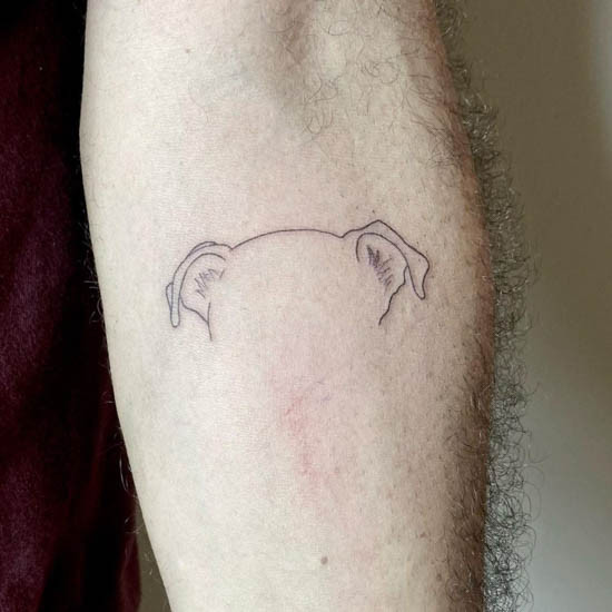 Idantatt minimalist dog ear tattoo