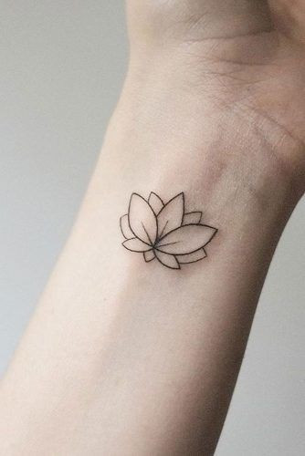 Delicate lotus flower wrist tattoo for women