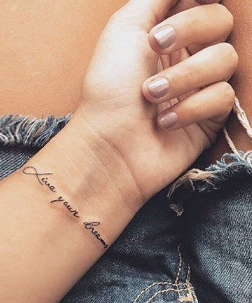 Elegant scripted quote wrist tattoo, a personal and meaningful word or phrase for women