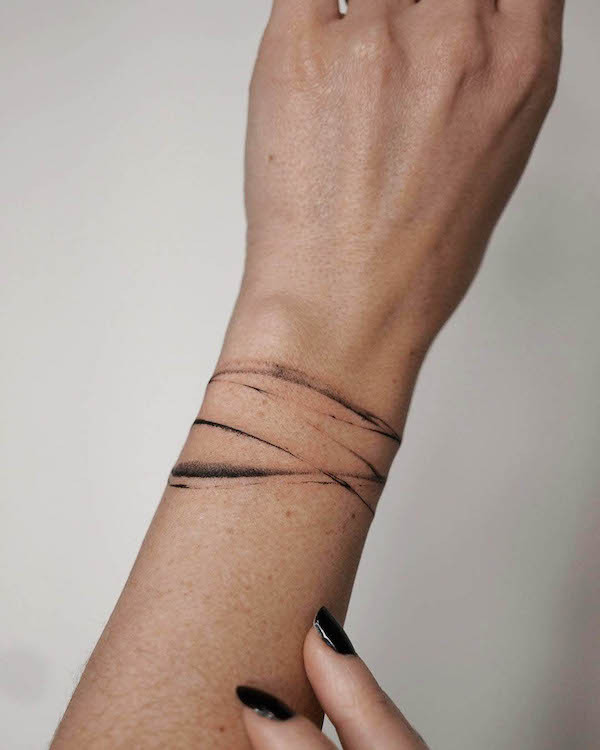 Unique abstract art wrist tattoo, a modern and artistic expression of personal style for women