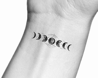 Moon phases line wrist tattoo for women