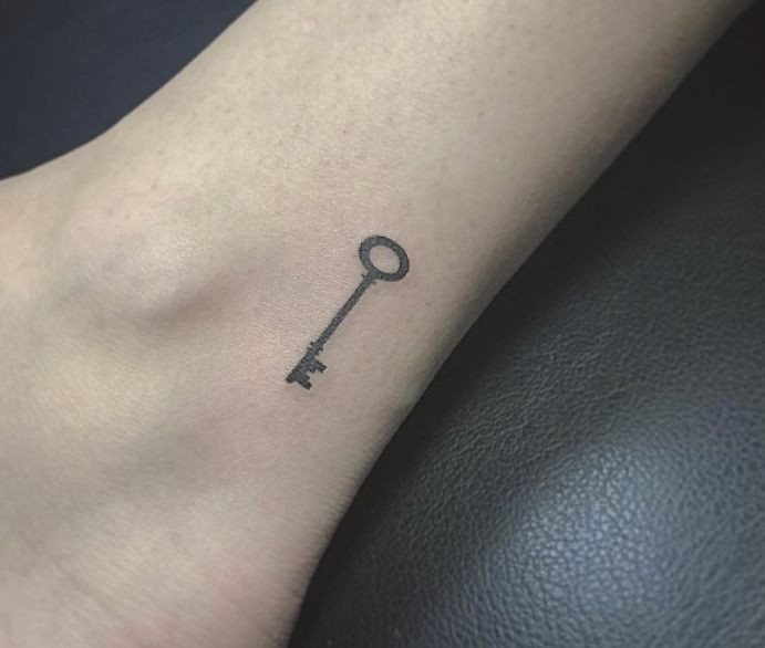 Vintage style key wrist tattoo for women