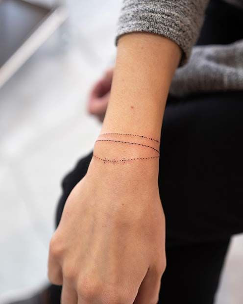 Chic delicate chain wrist tattoo, a minimalist and sophisticated design resembling fine jewelry for women