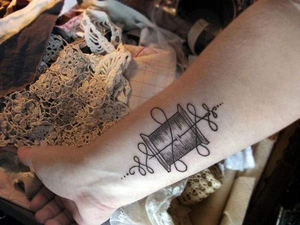 Atom wrist tattoo for science enthusiasts symbolizing the universe's building block