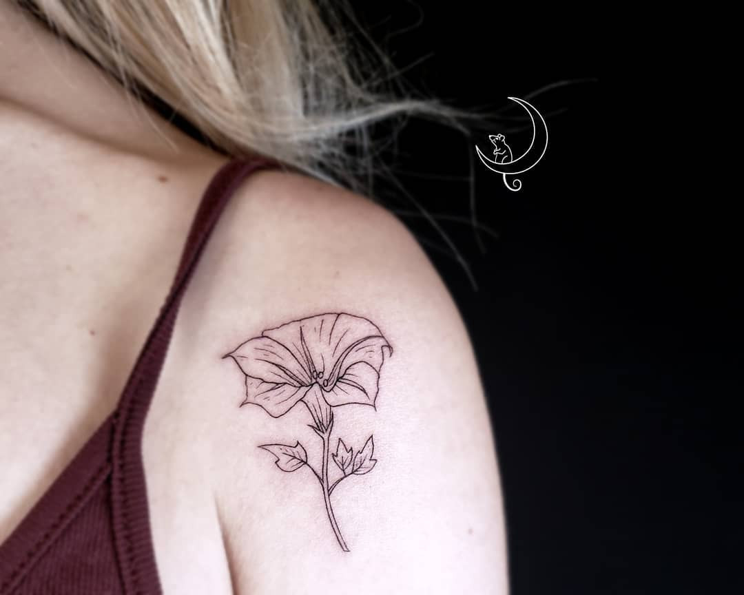 A detailed poppy flower tattoo, representing remembrance and peaceful dreams.