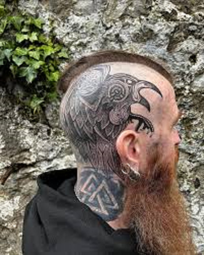 Scalp tattoo with a Viking theme, showcasing a series of interconnected geometric patterns and dark shading.